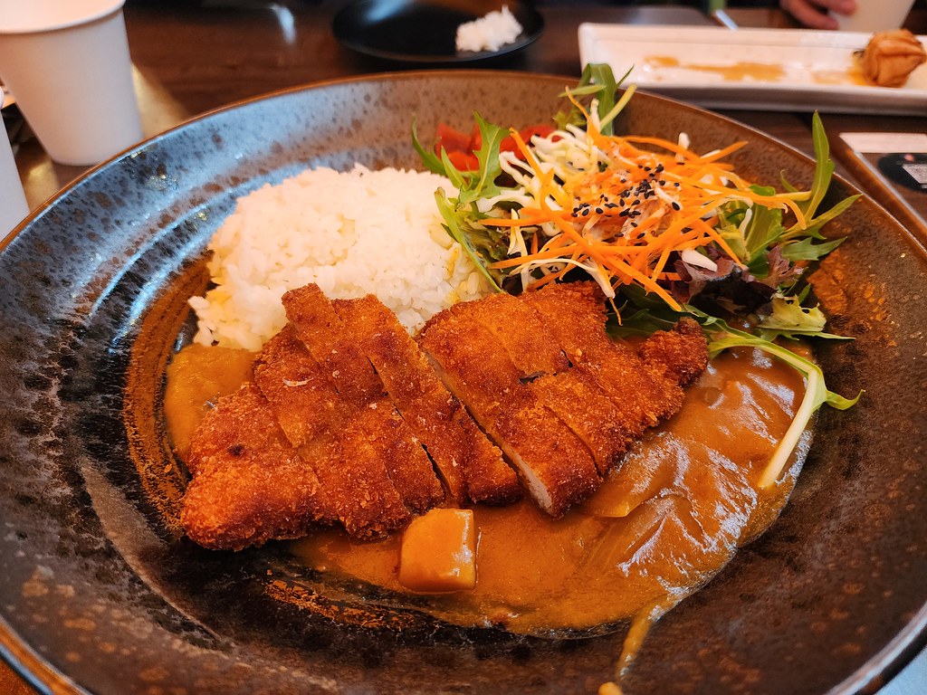 Chicken katsu with curry sauce veggies and rice.